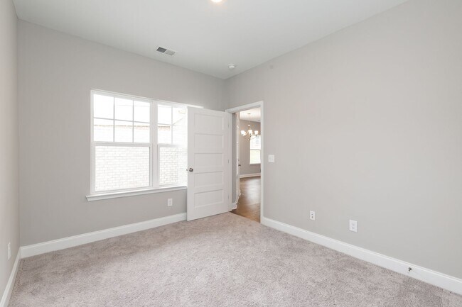 Building Photo - **BE THE LUCKY ONE TO LIVE IN THIS 2022-BUILT UPSCALE COTTAGE HOME IN THE PRESERVE AT BELLE POINTE**