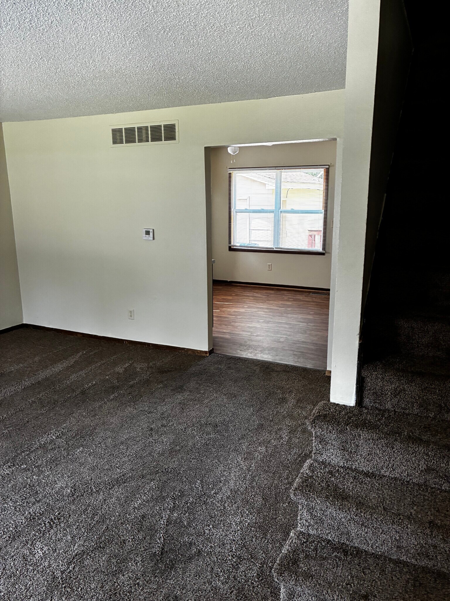 After you step inside, you see the living room and the entrance to the kitchen - 1205 Randolph St