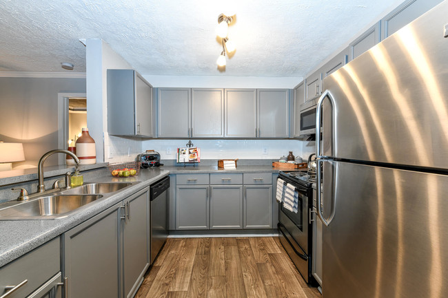 Classic Upgrade: Gray finish with Stainless Steel appliances, and updated lighting - Crestmark Apartment Homes