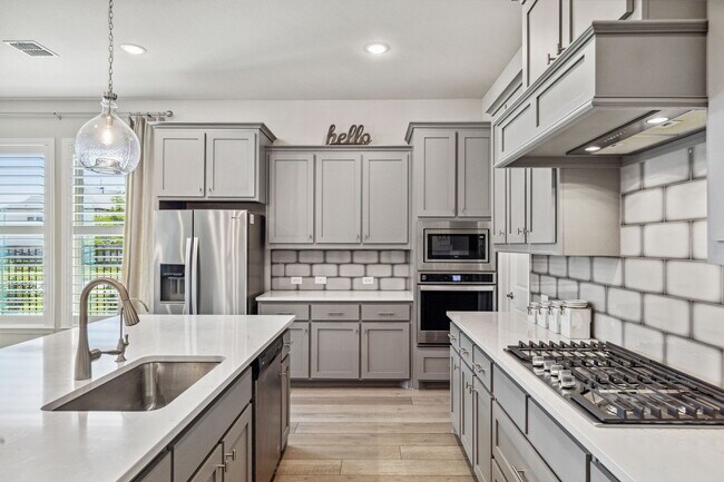 Kitche with 5-burner stove, SS appliances, ample cabinet space and large walk in pantry - 2871 Cannon Dr