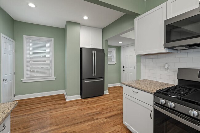 All new GE smudge-free, slate appliances, including french door refrigerator and gas stove with buil - 4517 Tracy Ave