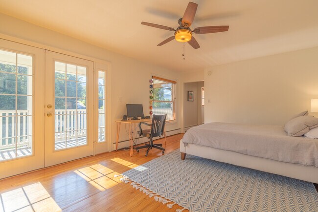 Primary Bedroom with Queen Bed, Private Porch, and Desk - 275 Kimberly Ave