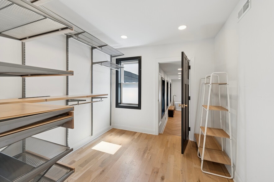 walk in closet connected to the primary bedroom and bathroom - 858 Perkiomen St