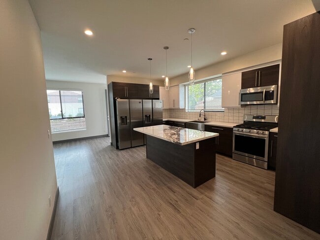 Building Photo - NEW SMART*4BD*4BA*TOWNHOME/ROOF DECK*CENTRAL AIR/HEAT*STAINLESS STEEL APPLIANCES*WASHER/DRYER IN ...