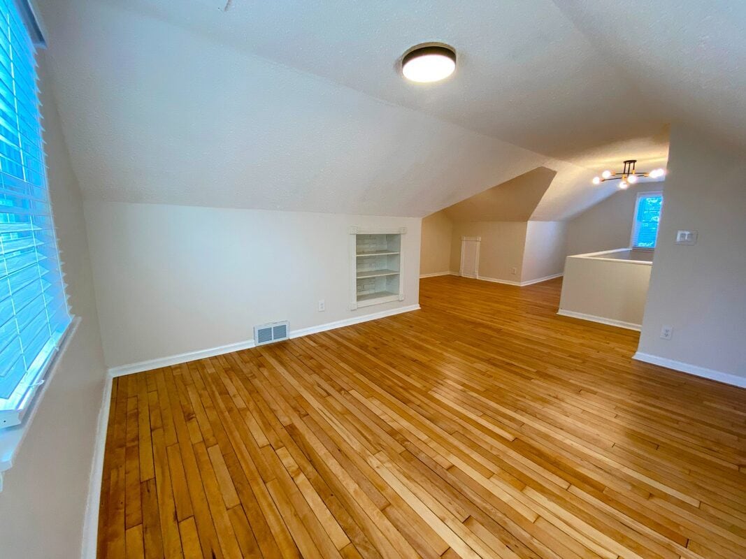 Primary Suite - Multiple windows flood the space with natural light - 710 Sheridan Avenue North