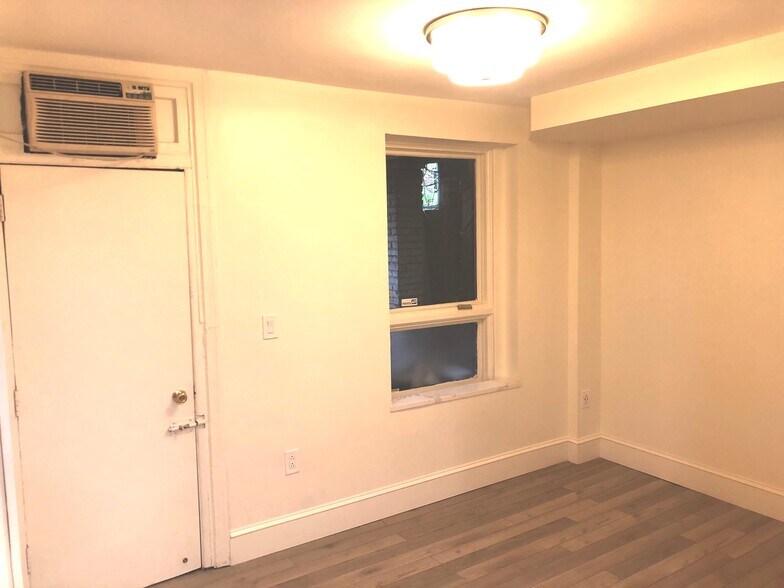 Bedroom with new LVP floor and window to the back patio - 623 S Carolina Ave SE