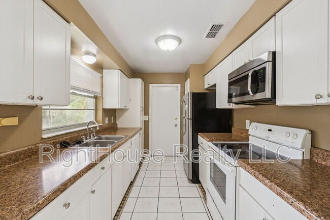 Building Photo - 6144 Rhythm Cir