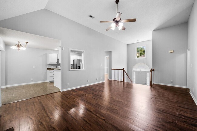 Building Photo - Stunning Stone Fireplace • Finished Basement • Fenced Yard