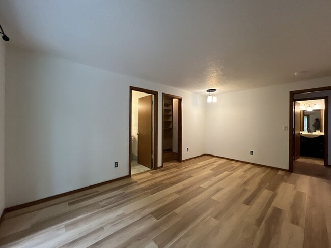 Building Photo - Spacious 3-Bedroom Home with Custom Stone Fireplace, Attached 2-Car Garage & Expansive Backyard i...