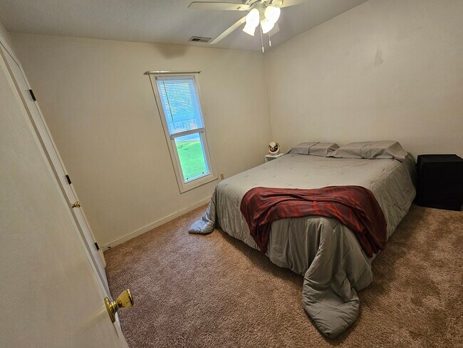 Front bedroom with view of front tree - 404 Rams Rd