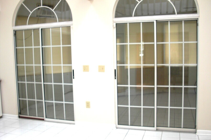 Doors to All weather room from Dining Room - 110 N Tampania Ave