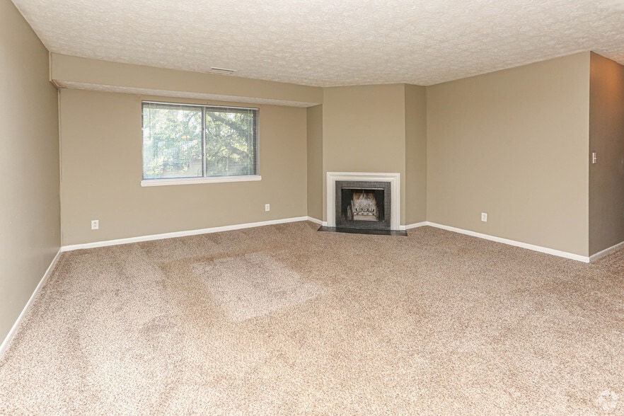 3BR, 2BA - 1,150 SF - Living Room with Fireplace - Patchen Place