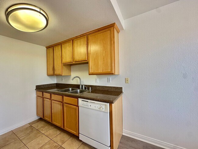 Building Photo - Updated Crown Point Condo With Wood Style ...