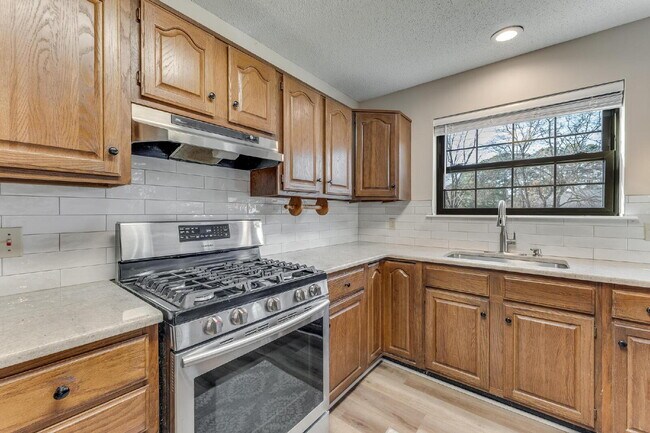 Building Photo - East Fayetteville 3-Bedroom Home with Granite Touches & Cozy Fireplace!"