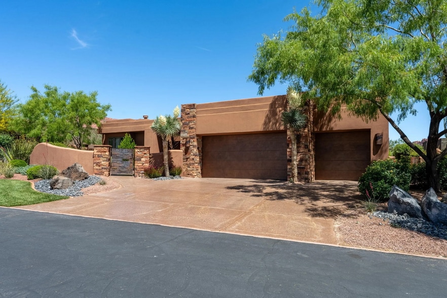 Three-Car Garage & Stone Facade Welcome Arrival - 1500 E Split Rock Dr