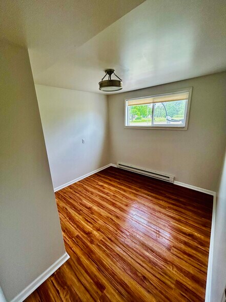 Bedroom 1 with new LVP Flooring - 931 E Clay St