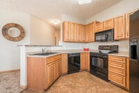 Our villas and duplexes include spacious kitchens with glass-top stoves for easy cleanup. - Stone Ridge Estates Apartments & Duplexes
