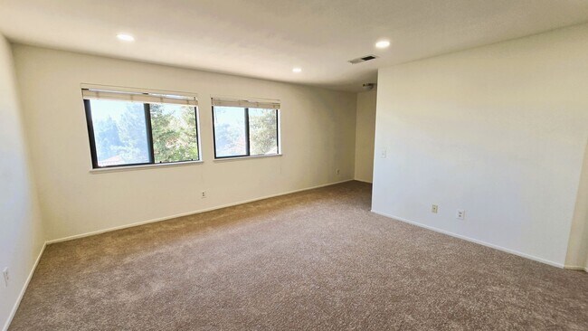 Building Photo - "Spacious, Sunlit Home in a Peaceful Ranch...