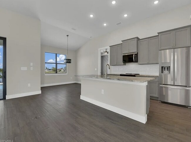 Building Photo - Almost New Construction Waterfront Home in NE Cape Featuring A Pool, Fenced Yard & More! COMING SOON