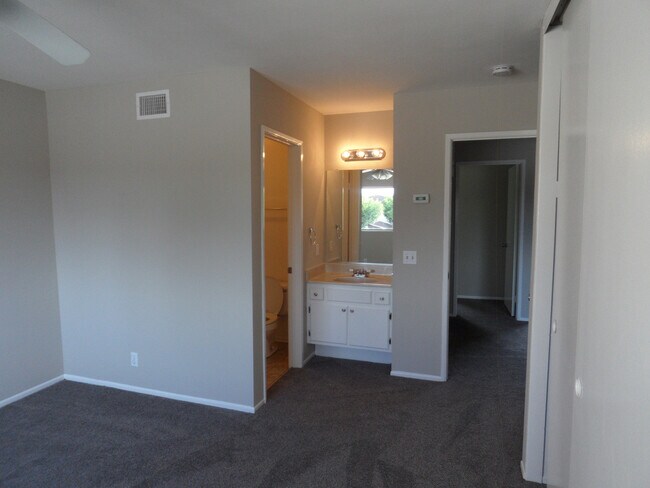 Building Photo - Two Story 4 BR 2.5 BA Condo With 2 Car Garage