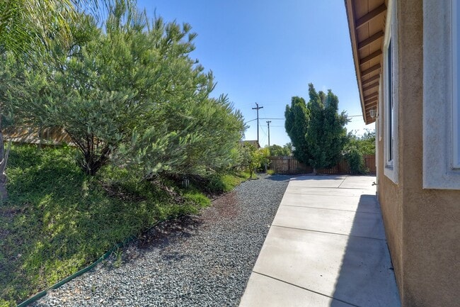 Building Photo - Charming 1-Story Corner Lot Home with Great Room & Patio