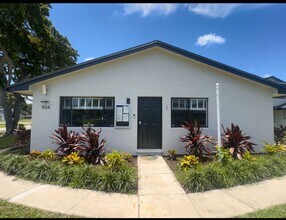 Building Photo - Clean and New with Garage Parking Included...