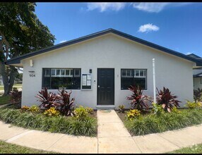 Building Photo - Clean and New with Garage Parking Included...
