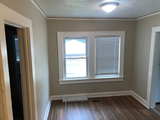 Building Photo - Freshly Painted 2x1 with Brand-New Plank F...