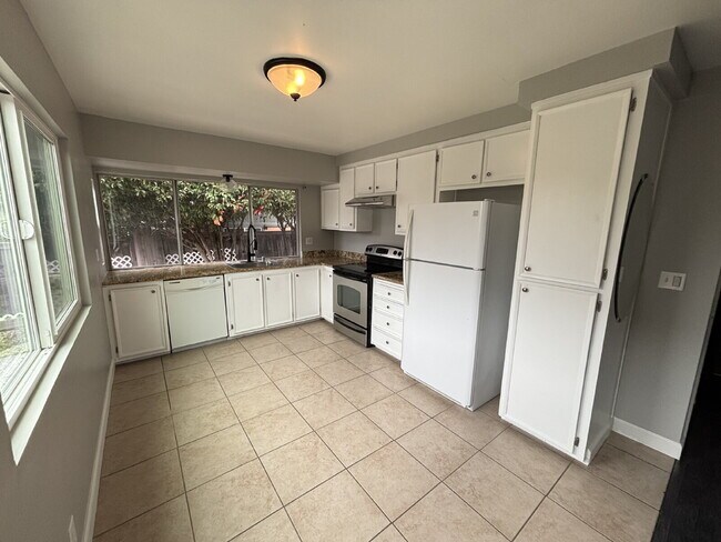 Building Photo - "Charming Concord Retreat: 3-Bedroom Gem with Granite Accents & Cozy Fireplace"