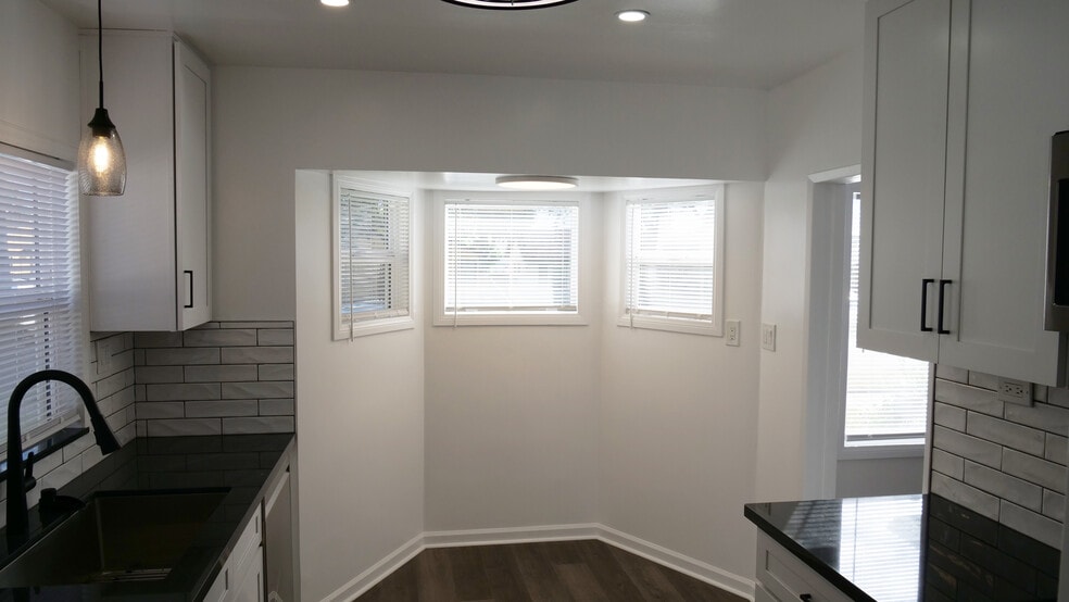 Kitchen nook. Recessed lighting and ceiling fan. Natural light. - 259 E Puente St