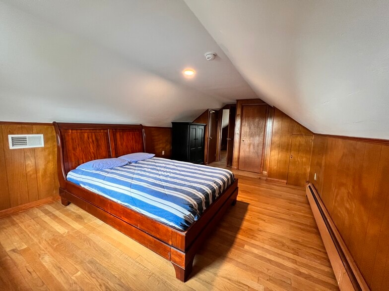 Primary bedroom on second floor with queen bed, 3 closets, & lots of natural light. - 324 Woodland View Dr