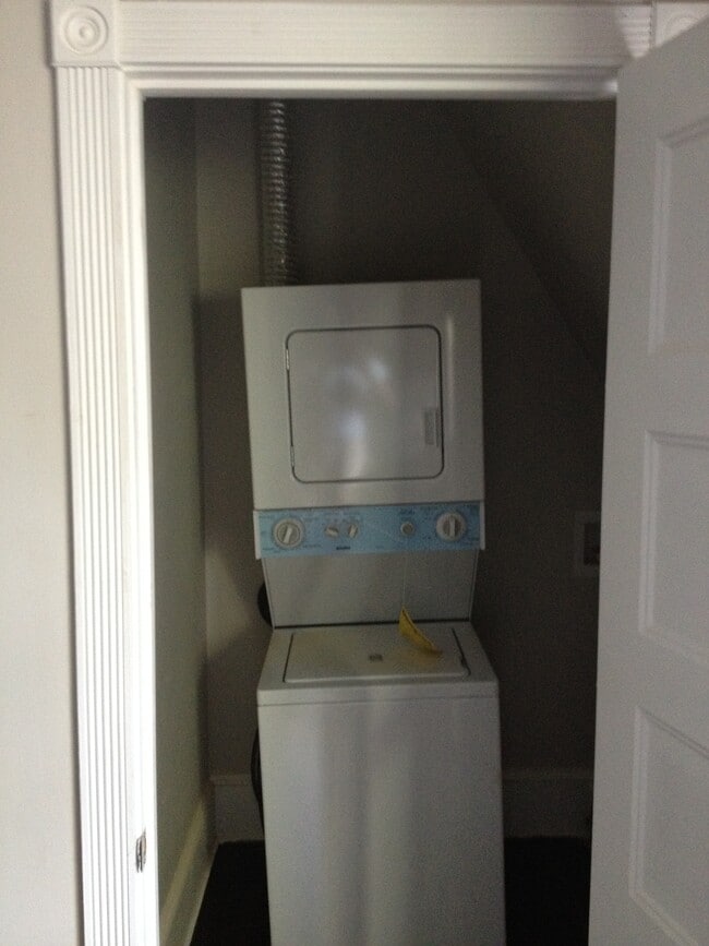 stacked washer/dryer in kitchen area - 7042 Chew Ave