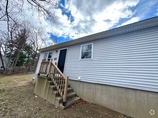 Front side of home, facing Coram Road - 122 Coram Rd