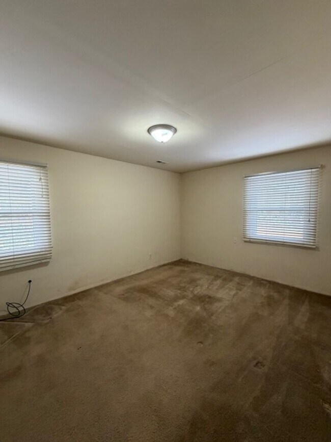 Building Photo - Tranquility inside. City adventures outside. Discover both in Downtown Cary!