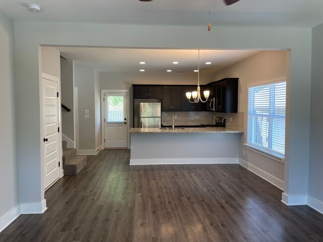 Building Photo - 3 Bedroom Home with Garage and Flat Fenced Backyard!
