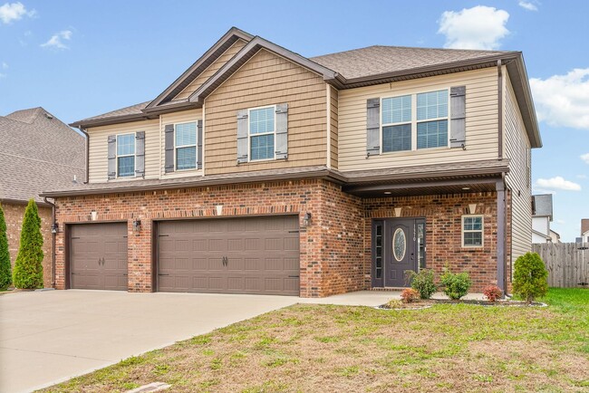 Building Photo - Four Bedroom with Three Car Garage!