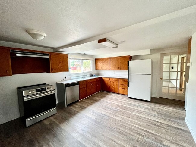 Building Photo - Cozy Single family home with two car garage and controlled access gate