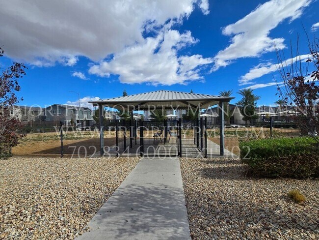 Building Photo - Gated~ 2 Bedroom Townhome w/2 Car Garage~MUST SEE!