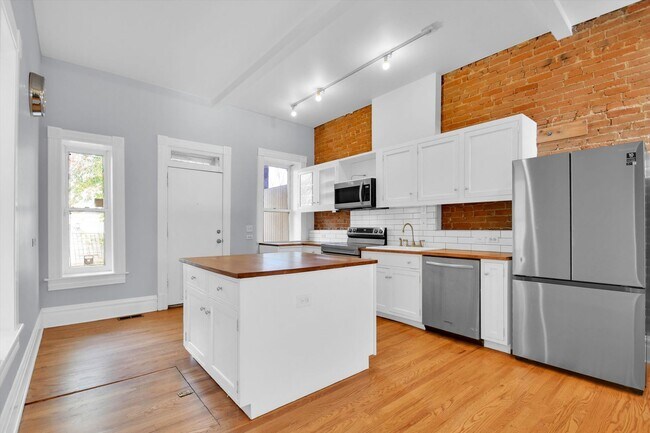 Building Photo - Architecturally Stunning Curtis Park Townhome With Historic Charm