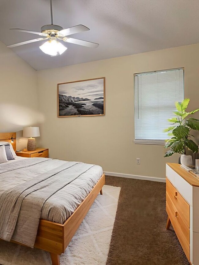 Building Photo - Welcome to Whispering Winds Townhomes – Wh...