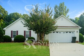 Building Photo - This home exudes a cheerful and welcoming charm!