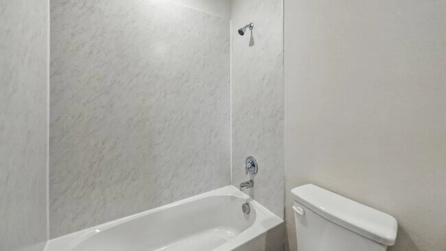 Building Photo - Beautiful new 4-bedroom, 2-bath home with an open floor plan, granite kitchen, two-car garage, an...