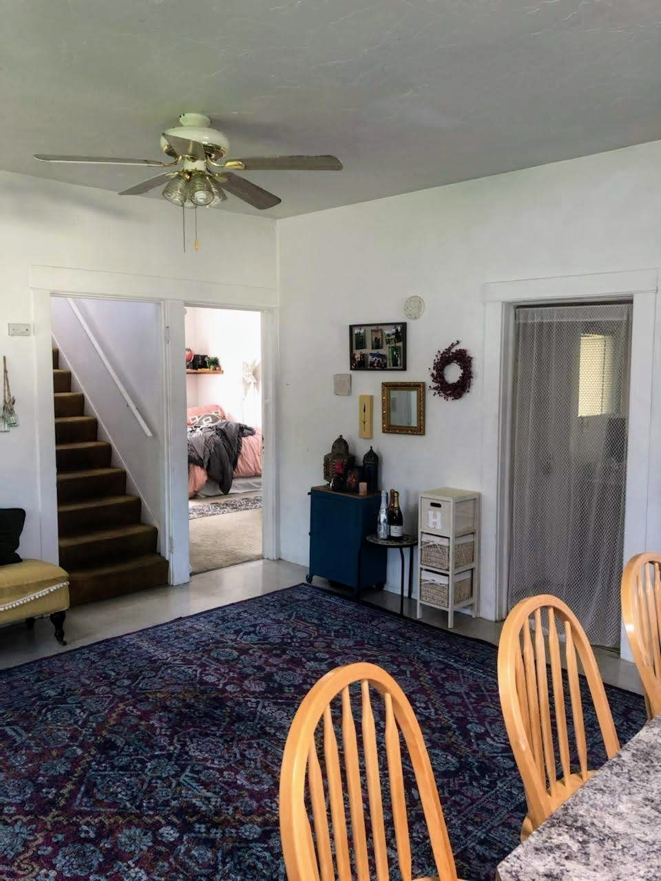 View from the kitchen - bathroom/storage to the right, bedroom entrance in the middle, stairway up to the left - 804 NW 29th St