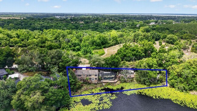 Building Photo - Available Now! Waterfront Living at Its Best – Pool, Decks & Gated Privacy