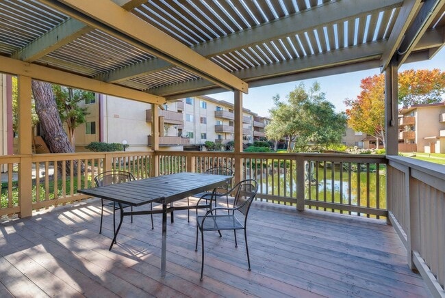 Building Photo - Modern 2-Bedroom Condo with Pool and Koi Pond Views