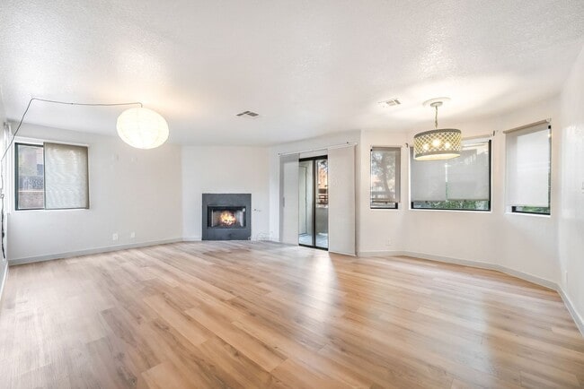 Building Photo - Upgraded Three-Bedroom Condo with Wood Flooring and Modern Comforts!