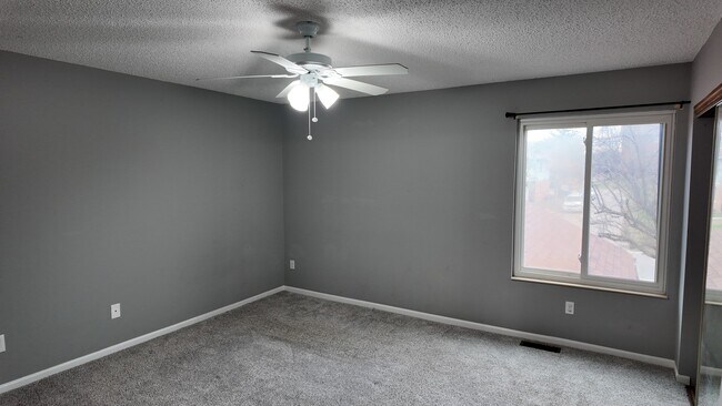 Building Photo - Spacious 2-Bed Townhome with Finished Basement, Pond View & Attached Garage in Fairfield