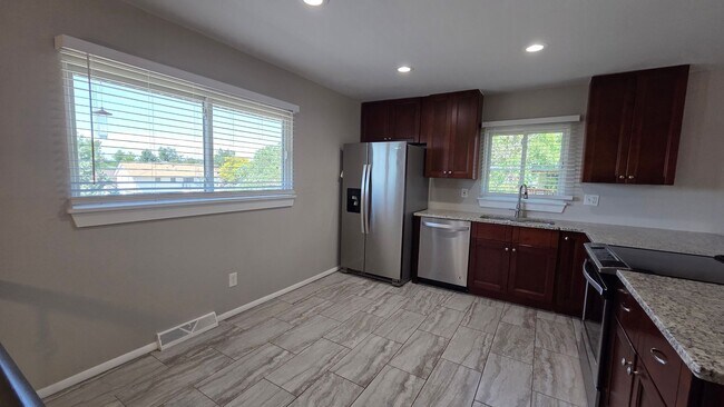 Building Photo - 4 Bedroom 2 Bath with Finished Basement and Study!