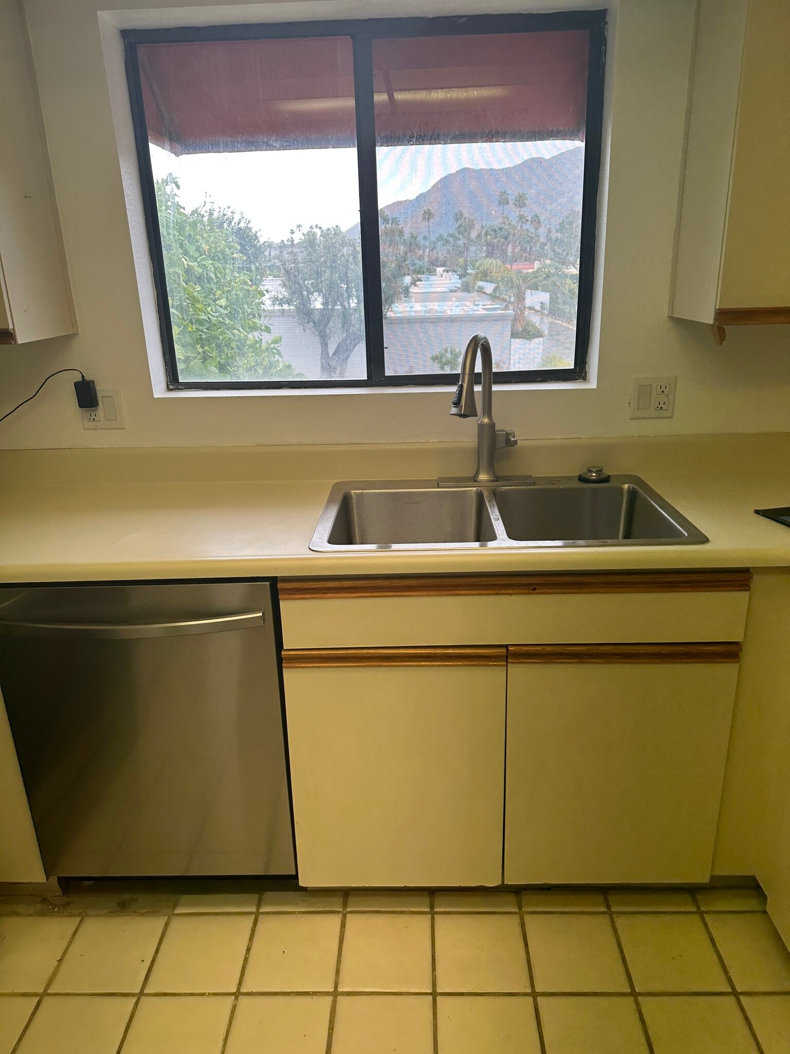 The view from kitchen window, new sink, and garbage disposal is in! - 255 E Avenida Granada