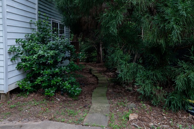 Stone walking path towards back yard - 2665 Merry Rd